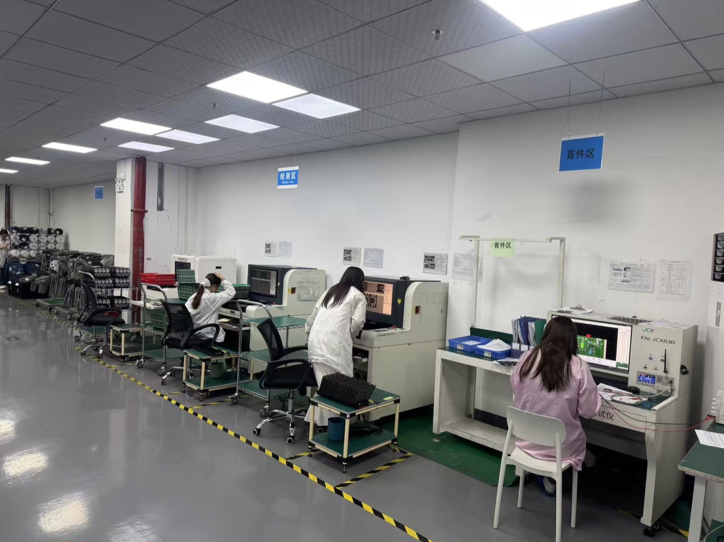 Operators at first-article and inspection workstations