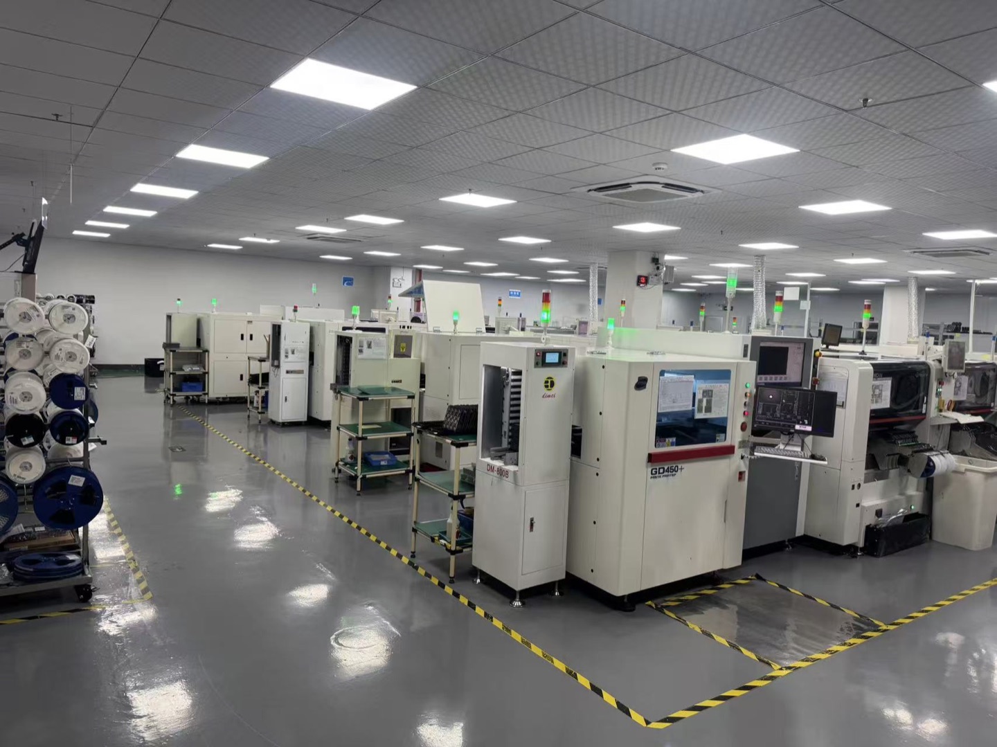Production workshop with component reels and assembly equipment